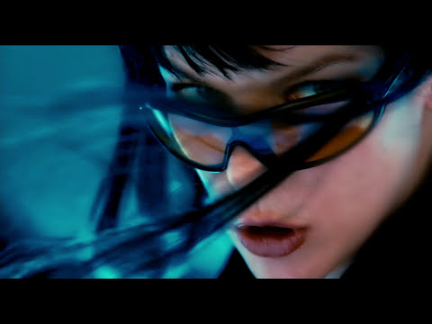 End-card style frame — skyline and credits palette echoing the score’s cool synth pads