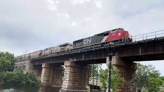 Cn 100 anniversary unit and ex crex trailing with 2 via rails and a cn intermodal train