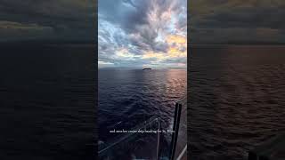 A peaceful Caribbean sunset at sea with 2 cruise ships