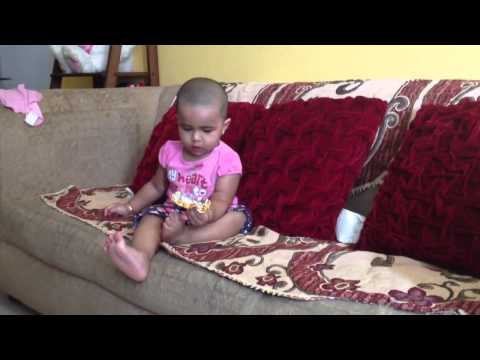 Samanvi Kruthi eating Naturo chocolate 1 year 1 month