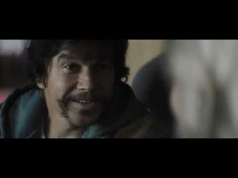 Trailer frame of reflective close-up that suggests prayerful scoring