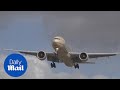 Incredible footage shows plane HOVERING in crosswind - Daily Mail