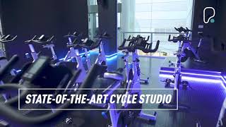 PureGym Hemel Hempstead: Functional training area with exercise rigs, green turf, weight racks, and low ceilings.