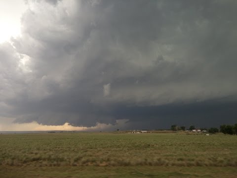 Supercell, rapidly rotating wall cloud, and brief tornado W of Hawk Springs, WY