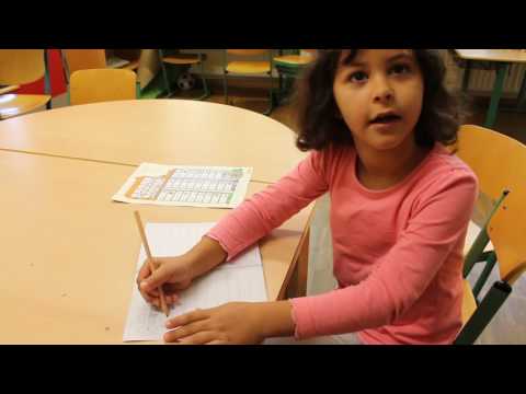 Sofie explains how to write using the phonetic chart.