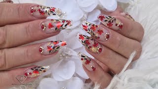 Autumn nails with encapsulated leaves and glitter made easy. Gel rebalance with clear buldier gel.