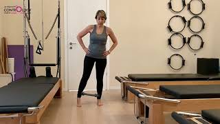 תרגול א- סימטרי לשיווי משקל וחיזוק מקרבים בעמידה עם חישוק פילאטיס