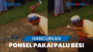 Viral Video Pria Hancurkan Ponsel Pakai Palu Besi, Diduga Pengurus Pondok Pesantren Hukum Santri