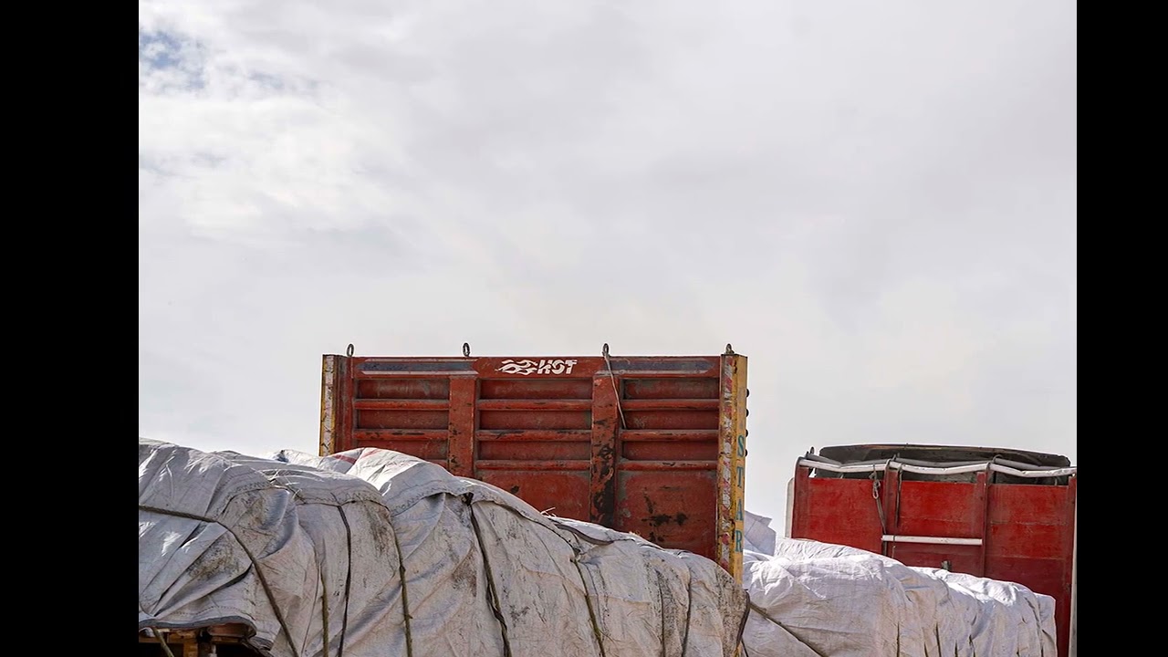 Convoy of aid trucks lines up at Egypt Gaza border in preparation for truce