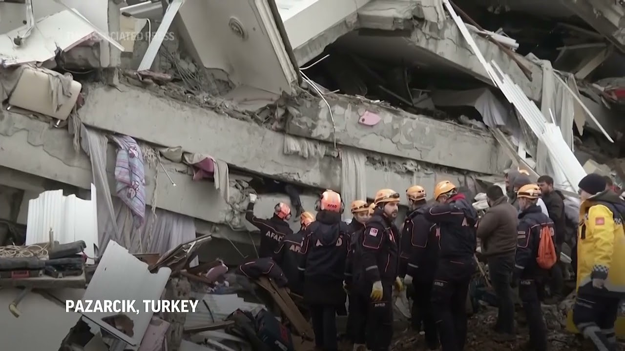 Rescuers work to save quake survivors
