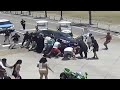 Good Samaritans Race To Lift Car Off Motorcyclist