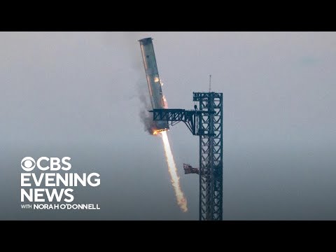 SpaceX 火箭助推器戲劇性著陸 (SpaceX catches rocket booster in dramatic landing)