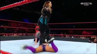 Nia Jax stands on Dana Brooke