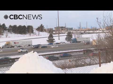 Video shows car flying off overpass onto Highway 401