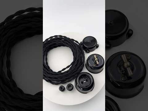 Ретро провід чорний кручений в поєднанні з керамічними вимикачами, розетками, розподільчими коробками