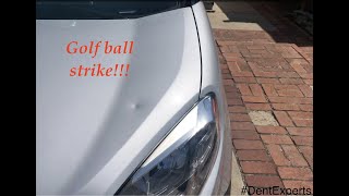 Paintless Dent Repair by Dent Experts - Sal Contreras for a Dodge Ram Hood golf ball dent