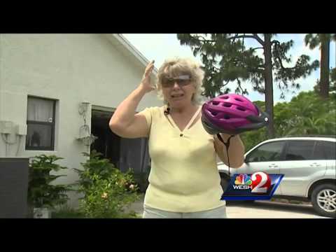 Dive-bombing hawks force woman to wear helmet