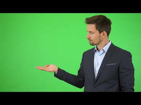 Green Screen | Chroma Key | A young handsome businessman puts out a hand with a product | 4K | HD