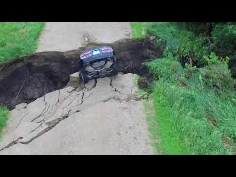 Image result for Minnesota teenager climbs out of car after it plunges into sinkhole amid heavy rains
