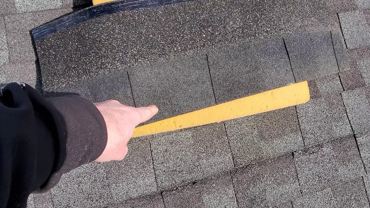 Wind damage to dimensional shingles.