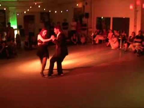  Diego Riemer  and  Maria Belen Giachello  are  dancing  to  a  tango