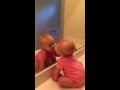 Baby Alli kissing herself in the mirror 