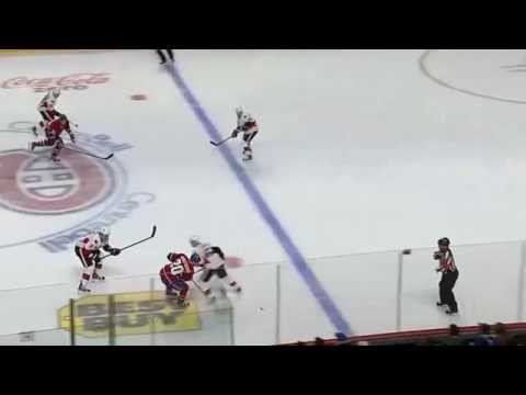 Andre Benoit hipchecks Colby Armstrong