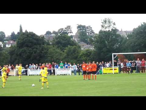 Tom Baker attempts a free-kick vs. Brighouse Town.