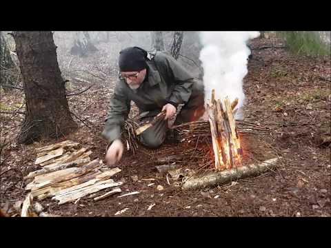 Making fire in the rain with damp material