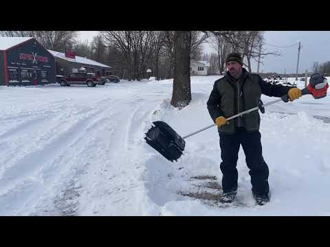 Husqvarna Power Sweeper moving snow at Super X Power in Milaca MN