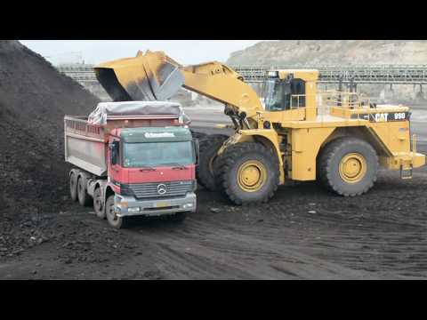 Caterpillar 990 Wheel Loader Loading Coal On Trucks And Operator View