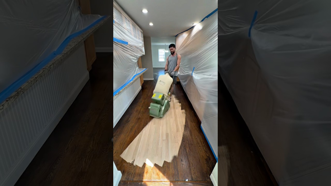 Old stained hardwood floor restored with professional sanding and refinishing