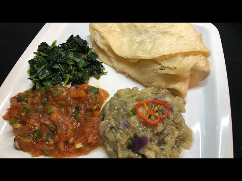 A classic Guyanese dish, Baigan Choka, Tomato Choka, Spinach and Paratha Roti