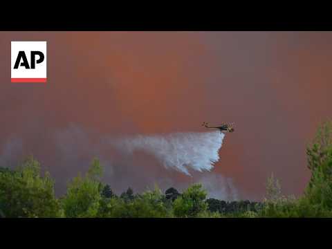 Video Thumbnail: Greece firefighters battle wildfire in seaside community of Porto Germeno