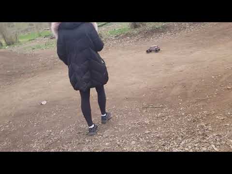 rc car mayhem.  Giants jumping. xmaxx vs phone .