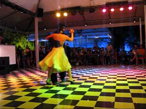  Pamela Ramos Aracena  and  Carlos Espinoza  are  dancing  to  the  vals  "  Temo  "  by  Orquesta Típica Victor  in  2011