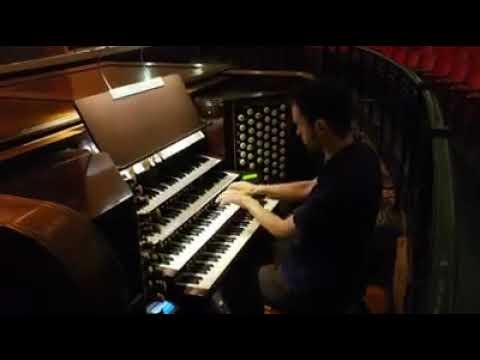 Organist Nathan J. Laube plays the Pilcher Pipe Organ