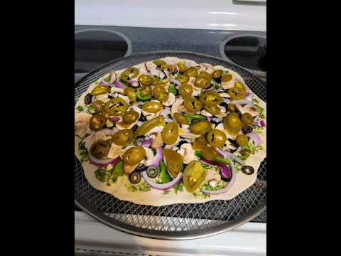 Homemade thin crust veggie pizza with homemade pesto