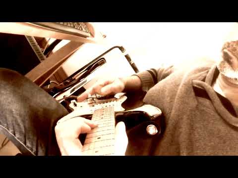 Alex Giallombardo practicing solos on a hard rock track