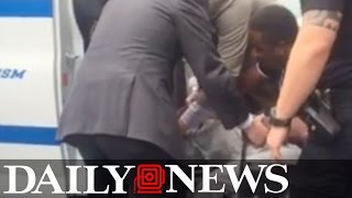 Rolland Collins, aka Troy Ave, wheeled into Manhattan Criminal Court