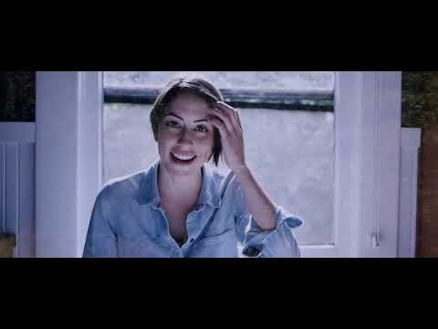 Trailer composition of the pair silhouetted on a ridge; end-credits vibe