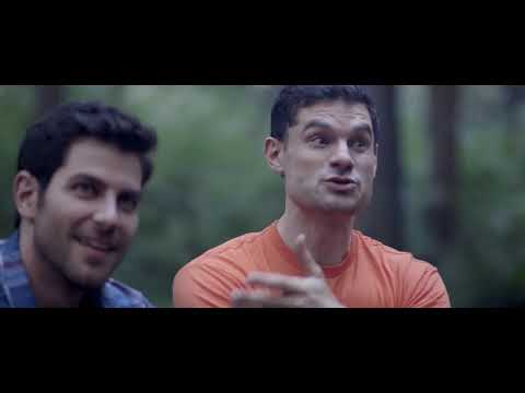 Buddymoon (2016) official trailer still with David Giuntoli and Flula Borg hiking