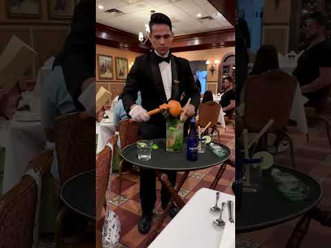 Ybor, Tampa, Florida 2024 Columbia Restaurant waiter making mojitos