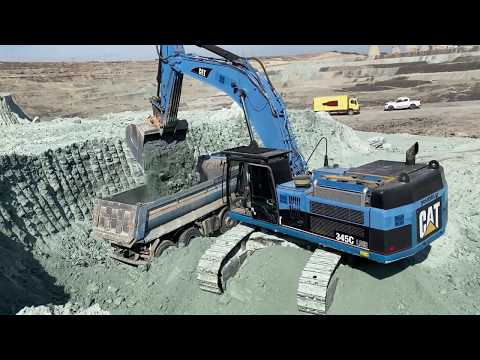 Caterpillar 345C Excavator Loading Trucks