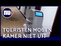 Robot in Wuhan bezorgt eten aan geïsoleerde toeristen in hotel | NU.nl