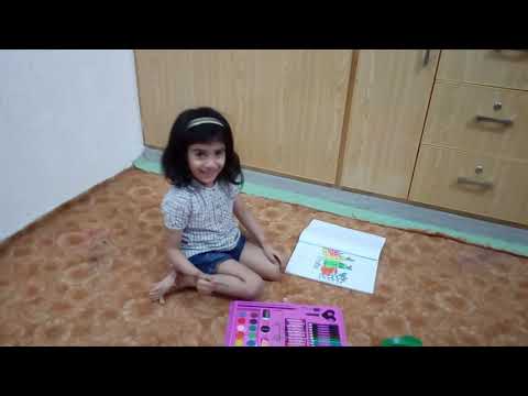 Little Huriya coloring the fruits