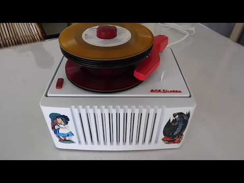 RCA Alice in Wonderland 45 RPM record player playing a stack of 45's