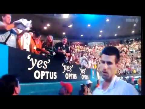 Djokovic tries to give shirt to a girl in the crowd but the fat lady snatches it.[Very Funny]