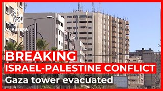Dozens of Palestinian families evacuate tower block under threat
