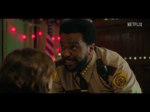 Hot Frosty official trailer still with Lacey Chabert and Dustin Milligan in a snowy town